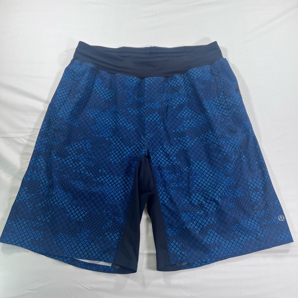 Lululemon Assert Short 9" in the Macro Geo Camo Kayak Blue Deep Navy colorway